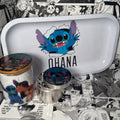 The SpicedAnime Ramen Stitch Grinder, Jar, and Rolling Tray Set features a white tray with cartoon Stitch and OHANA text, a grinder, and a glass jar with Stitch and Angel, all set against black-and-white manga panels.